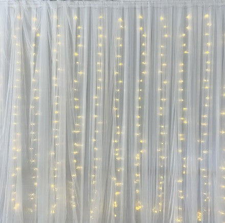 Bridal Backdrop with Silk Curtain and Warm Light